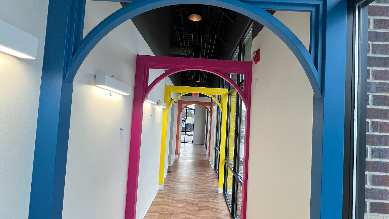 Colorful arches in a modern hallway.
