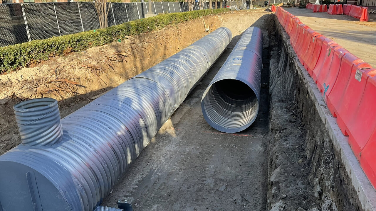 Large pipes in a construction trench.