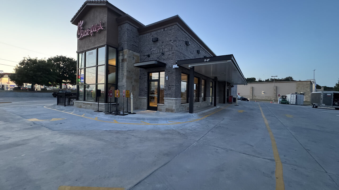 Restaurant exterior with drive-thru and parking area.