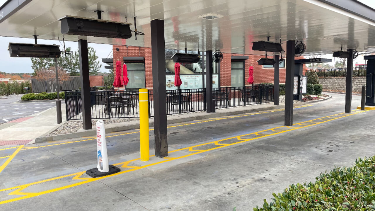 Drive-thru area with outdoor seating.