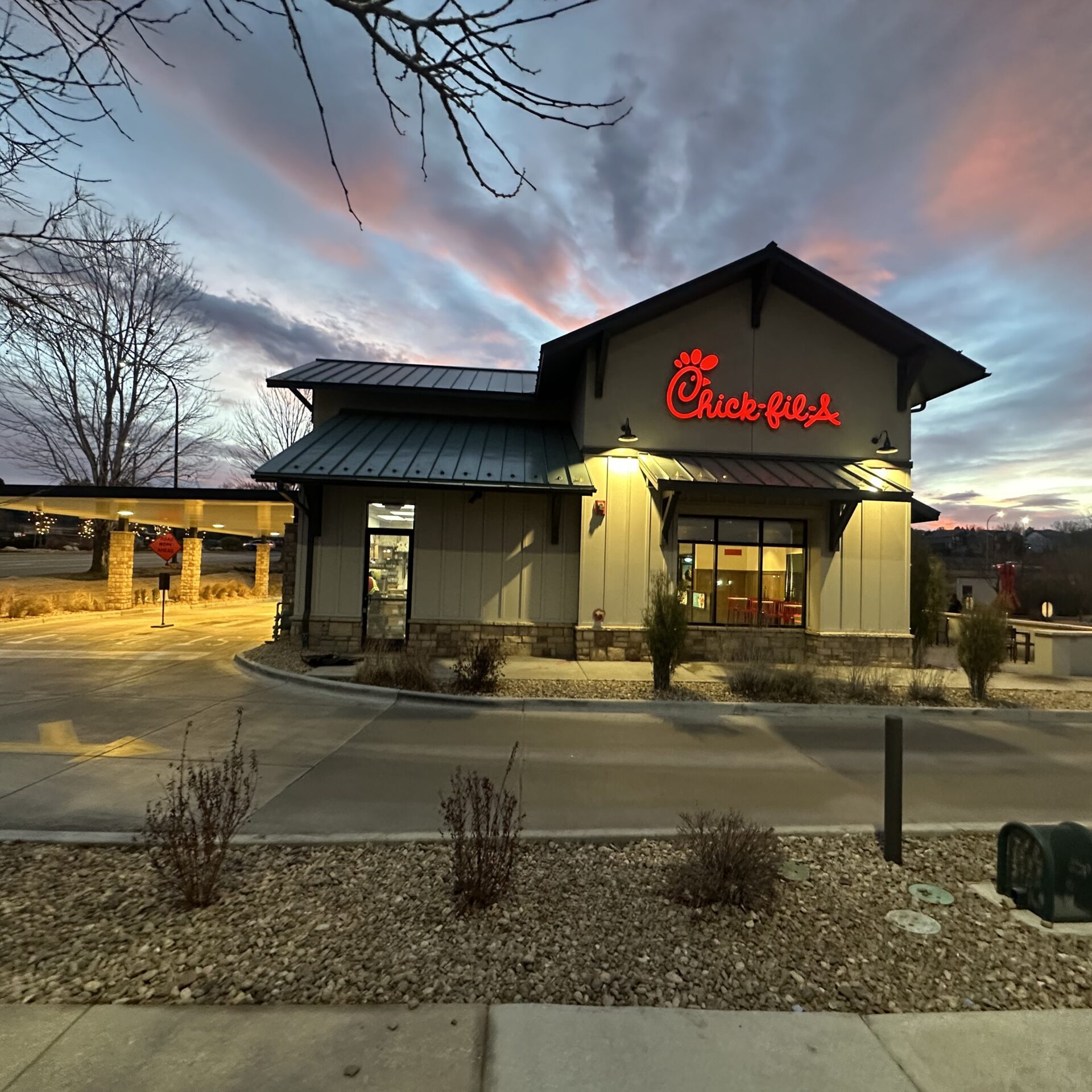 Chick-fil-A restaurant at sunset, exterior view.